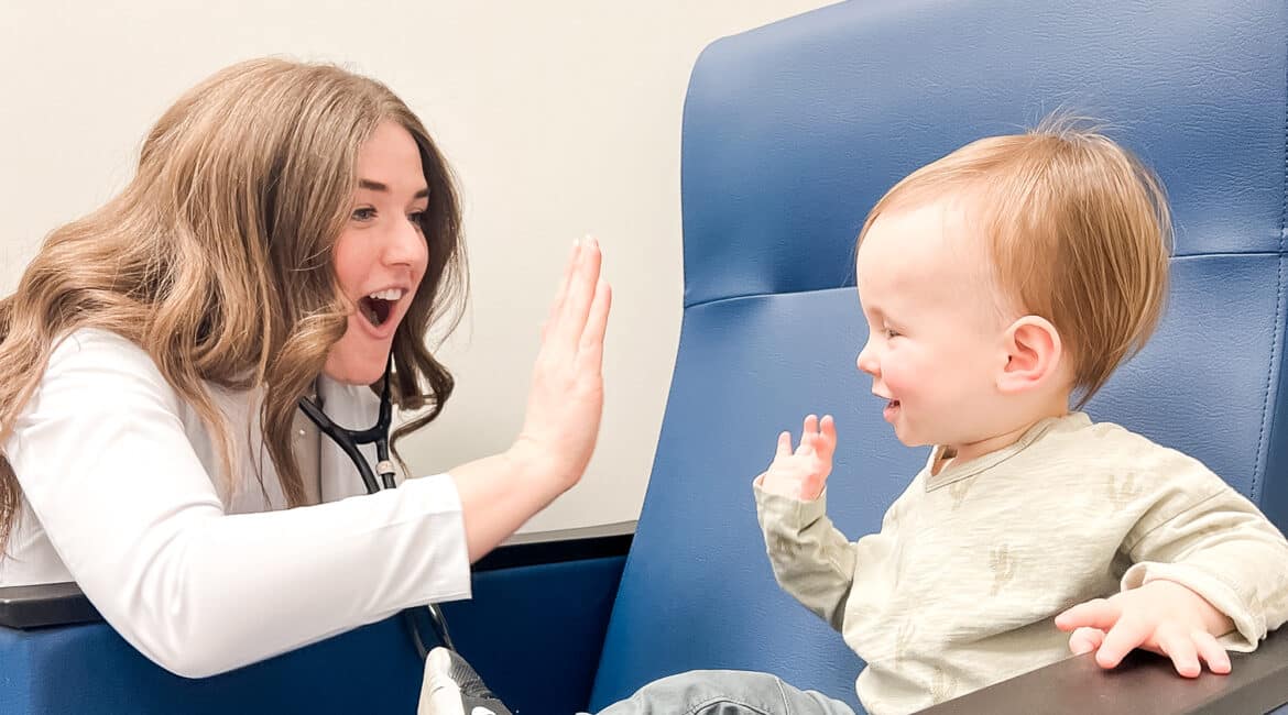 nurse practitioner and toddler high fiving